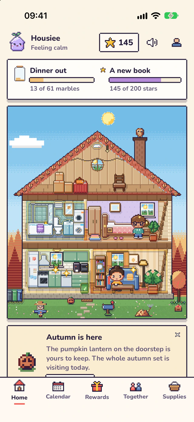 The Home screen by day: the dollhouse under a blue sky, the week’s goal Dinner out at 13 of 61 marbles, A new book at 145 of 200 stars, and a card saying autumn is here.
