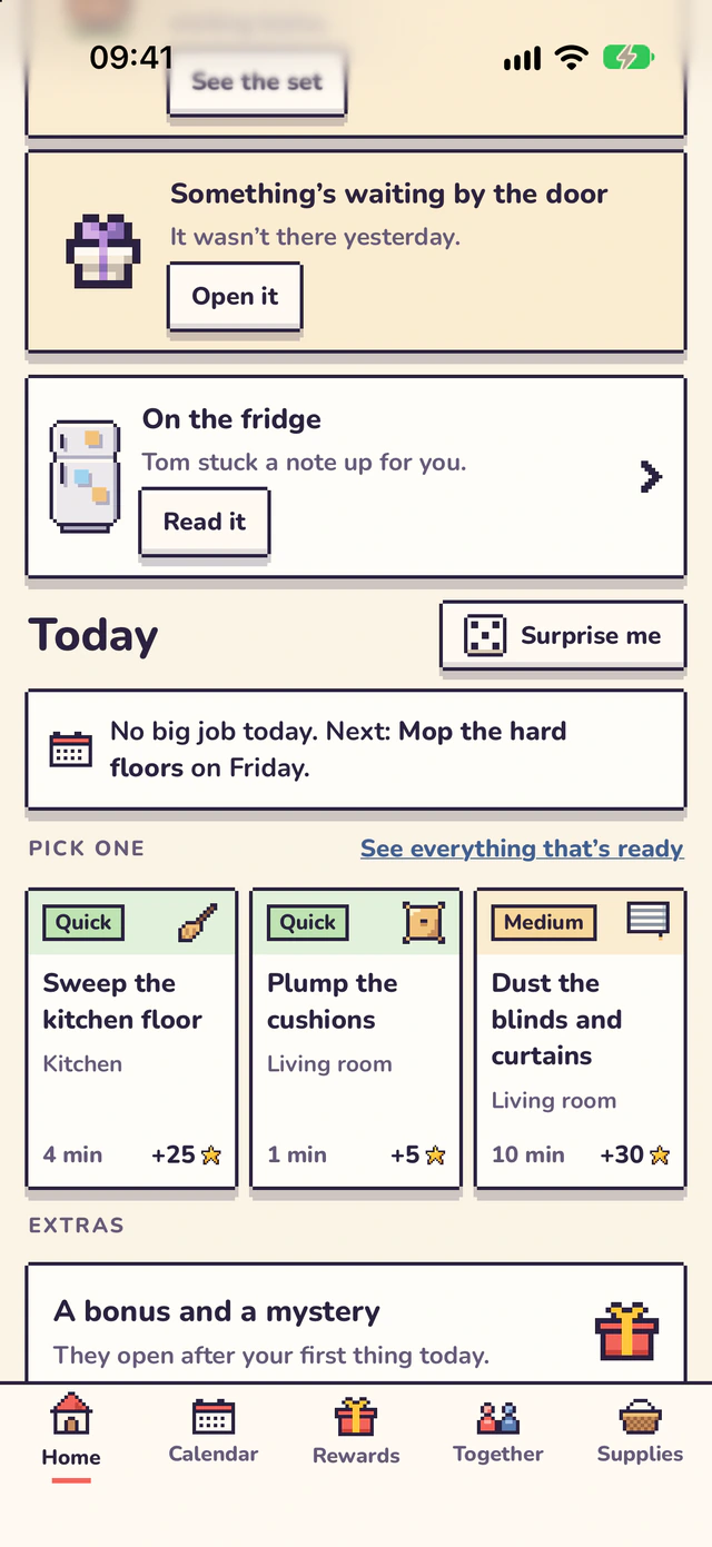 Further down Home: a gift waiting by the door, a note on the fridge from Tom, Today with a Surprise me button, no big job today, and Pick one with three chores: sweep the kitchen floor, plump the cushions, dust the blinds and curtains. Below, a bonus and a mystery.
